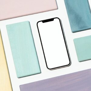 Canva social media kit cover mockup: smartphone with pastel accents and space for grid tiles.