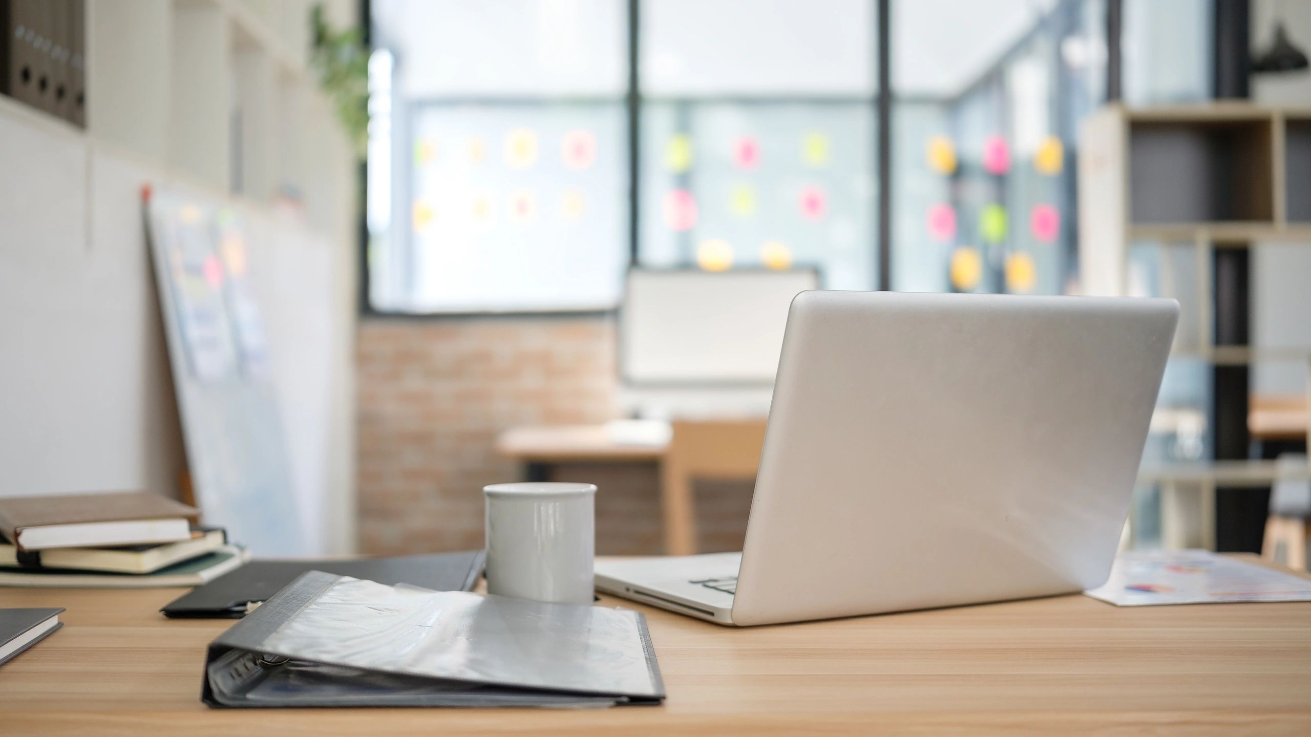 Modern workspace with laptop and documents representing website templates