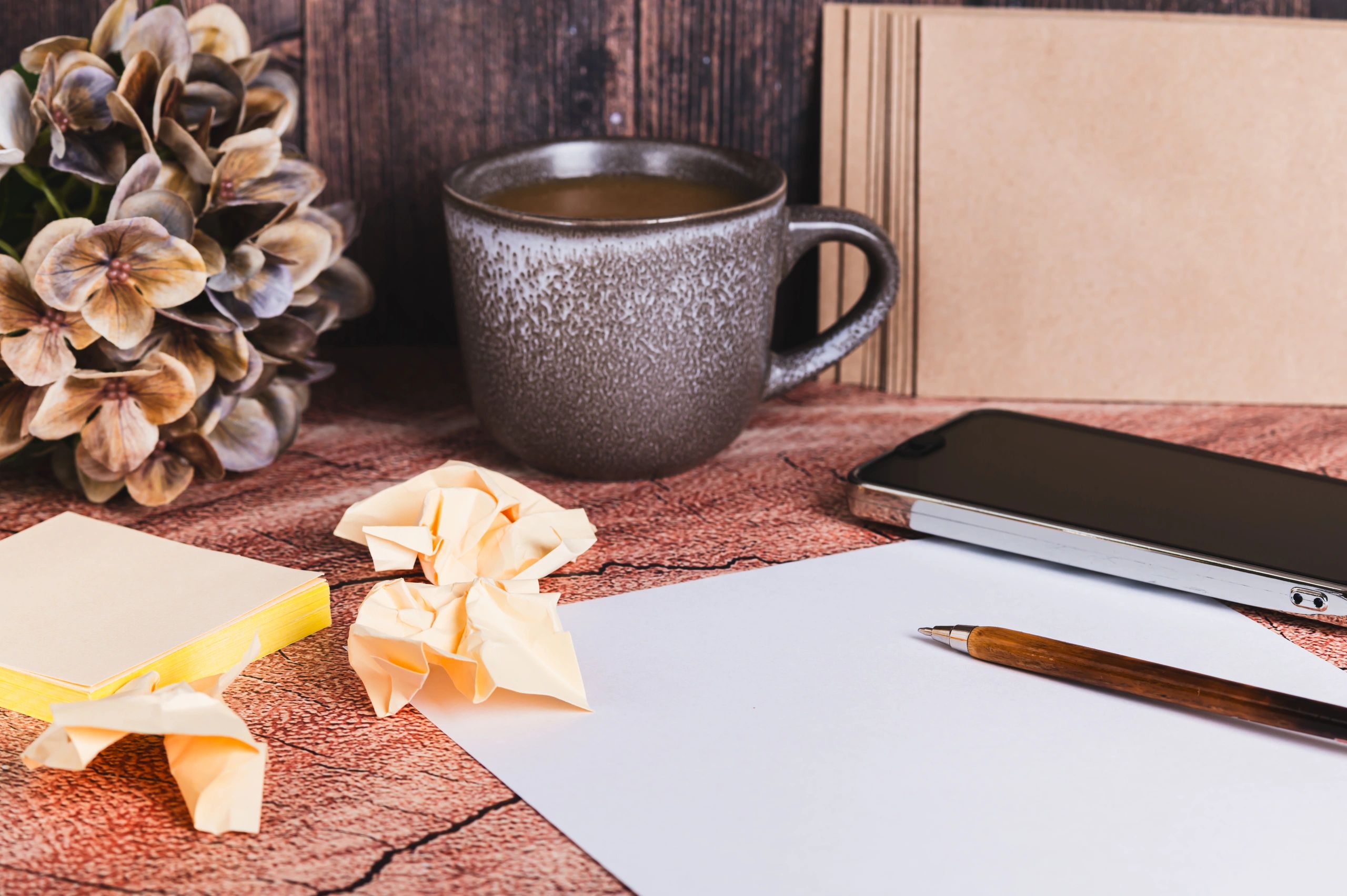 Resume paper and pen on a desk representing CV and resume templates