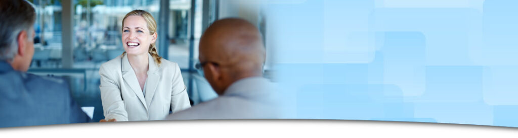 A woman talking to two men